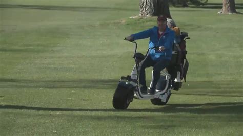 Aurora golf course using scooters as golf carts